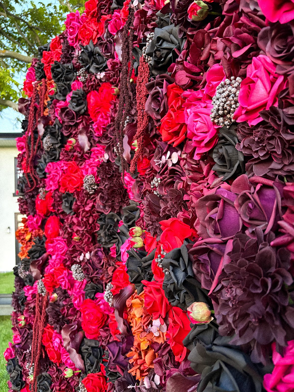 Side angle of the Midnight Bloom flower wall showing its full depth and texture