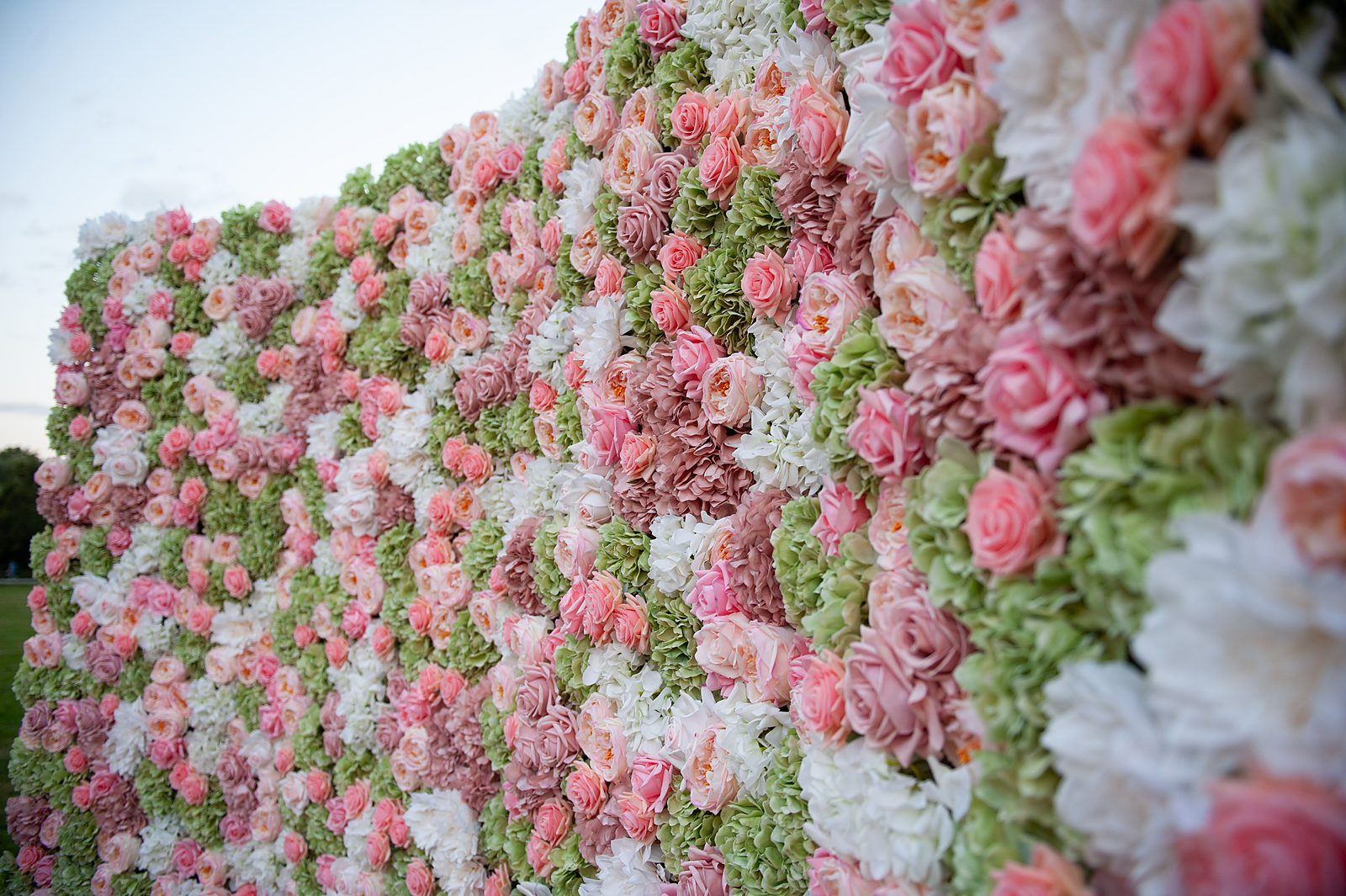Well-lit detail of the English Garden green and blush Real Touch flower wall