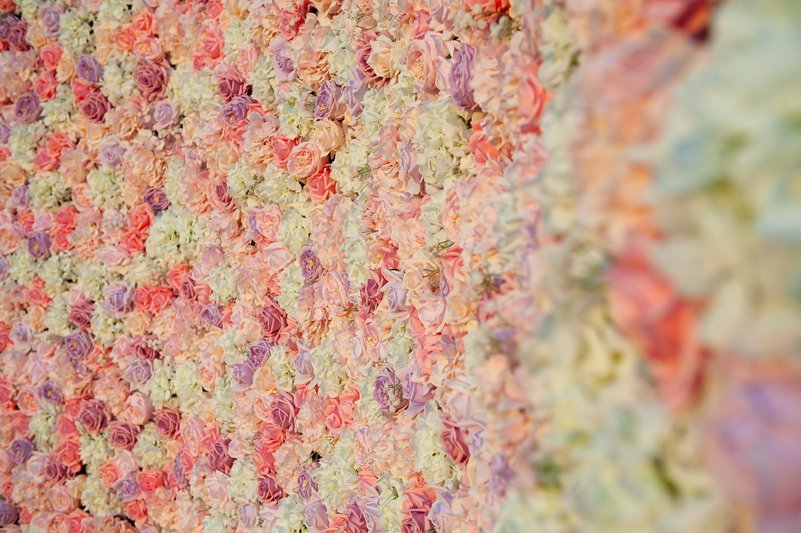 Wide close-up of blush, mauve and ivory Real Touch flowers